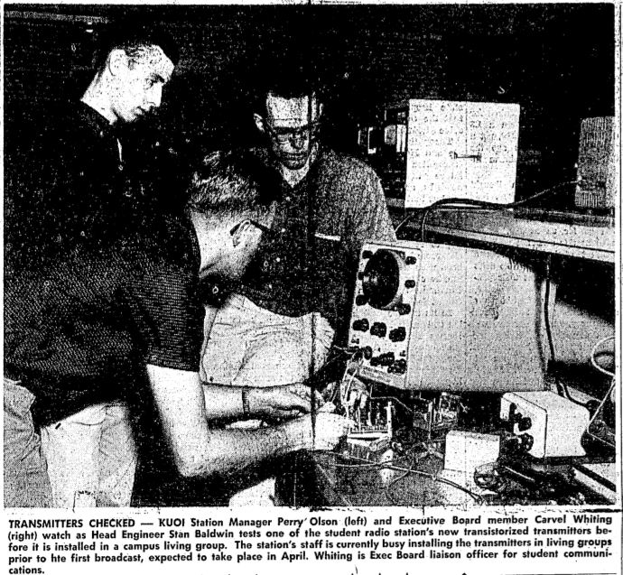 students looking at radio broadcast equipment