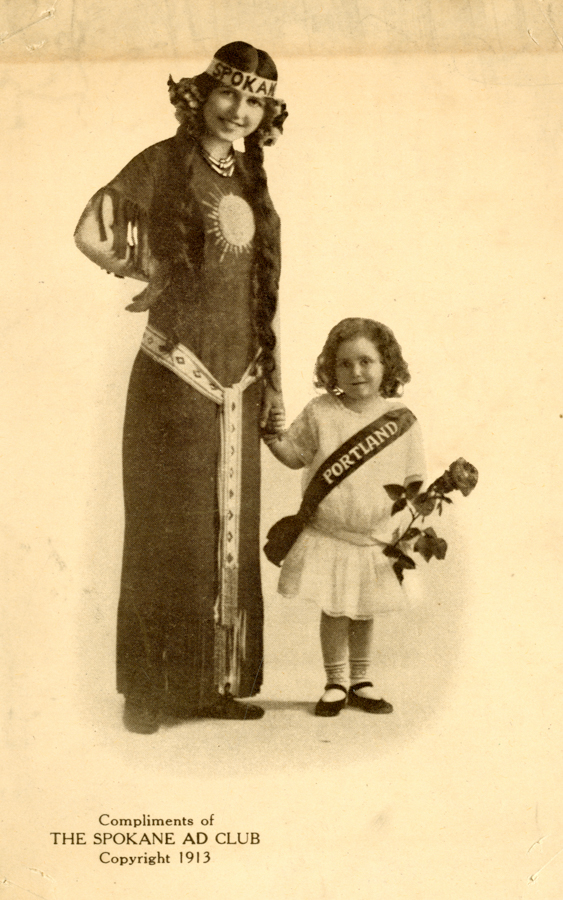 A woman dressed in a decorated long dress stands holding hands with a young girl. The woman wears a headband labeled "Spokane" and her dress features a sun design and patterned belt. The girl is in a dress with a sash labeled "Portland" and holds a rose. Text at the bottom reads "Compliments of THE SPOKANE AD CLUB Copyright 1913."