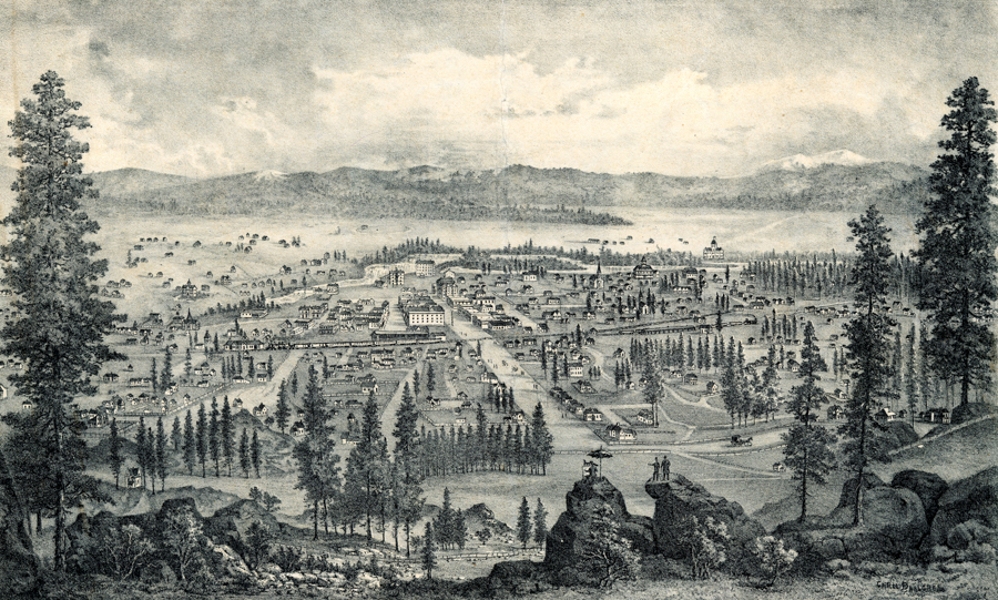 A panoramic view of a town in a valley surrounded by hills and mountains. There are numerous buildings, both large and small, with roads lined with trees. In the foreground, three figures stand on rock formations overlooking the town. The landscape is dotted with additional trees, and there is a mix of open fields and structures.
