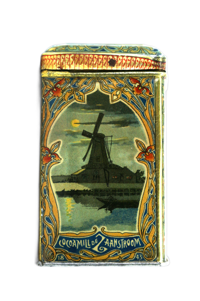 A decorative tin featuring an illustration of a windmill by a waterway under a moonlit sky. The border is adorned with intricate floral patterns. Text at the bottom reads 