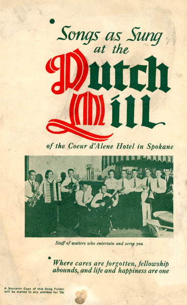 Group of people next to a wooden cabinet with decorative plates. Each holds a musical instrument, including an accordion, trumpet, and guitar. Text reads, 