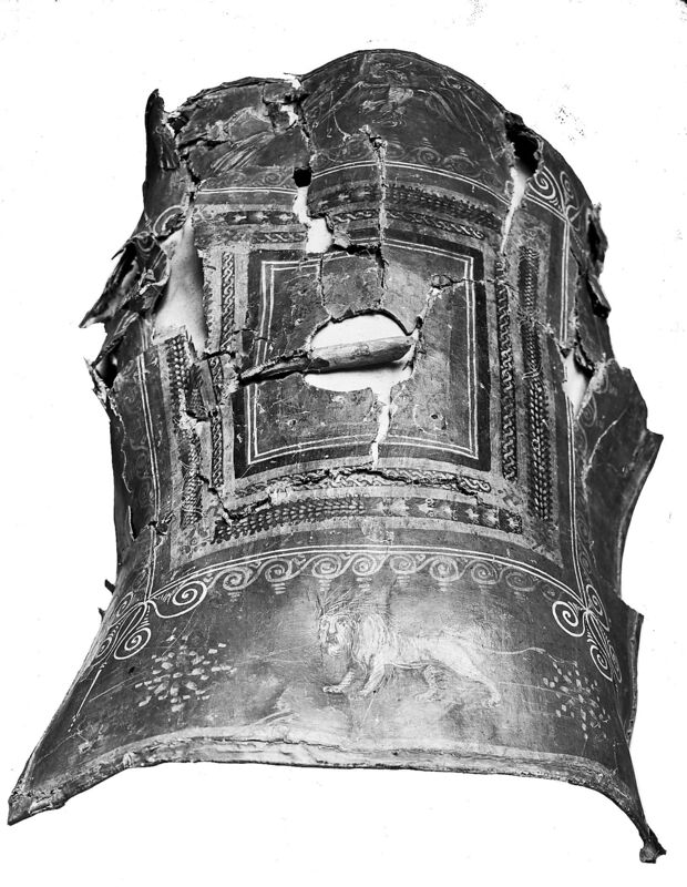 Curved damaged Roman scutum designed for formation fighting and full-body protection