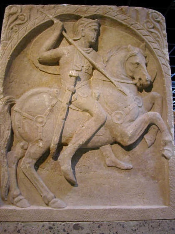 Cavalryman with spear on horse on limestone tomb