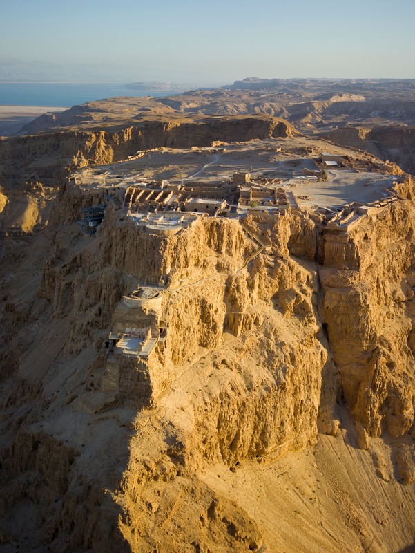 drone picture of fortress ruins on a desert mountain