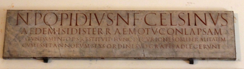 Plaque above temple doorway that describes a generous donation to rebuild the temple after an earthquake.