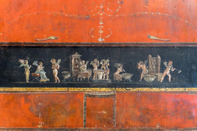 Roman fresco on a black background showing cupid figures making perfume in three main steps before presenting it to a woman