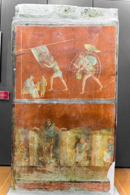 Front of a pilar fresco, that shows the daily tasks of a fullo.