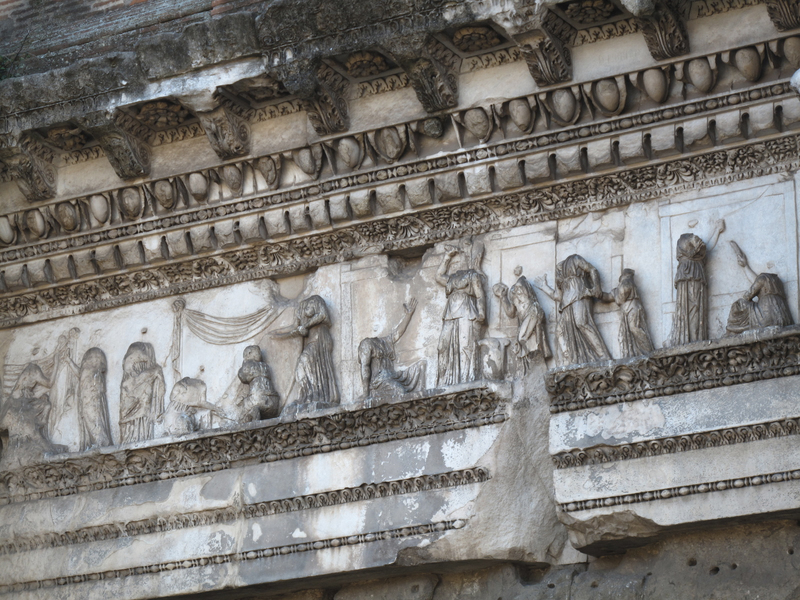 Marble relief from the Colonnacce of the Forum of Nerva in Rome (late 1st century CE), depicting the myth of Arachne. At the center, Arachne cowers as Minerva strikes her, while surrounding women engage in weaving and textile work