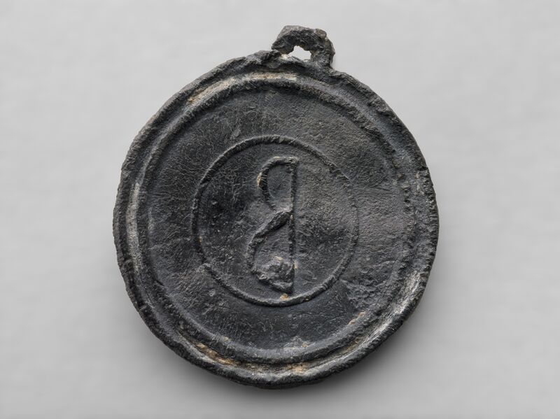 Circular lead weight (2nd-6th century CE), discovered in Antioch in 1937. Likely used in textile production and trade, this small standardized weight—marked with a Greek letter—would have helped measure materials such as wool, dye, or thread. Its inscription reflects the regulated systems of measurement that enabled commerce across the eastern Roman Empire. Source: Princeton University Art Museum, https://artmuseum.princeton.edu/art/collections/objects/14218.