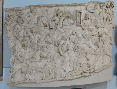 Plaster image showing cavalrymen in battle